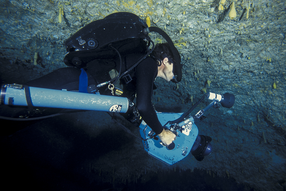 John McKenney diving his Biomarine Mark 15.5 Closed Circuit rebreather begins his decent back towards the cave’s entrance.